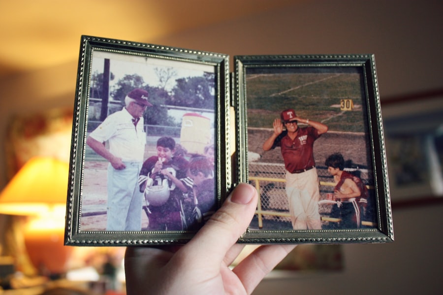 A hand holding a double picture frame with old baseball photos