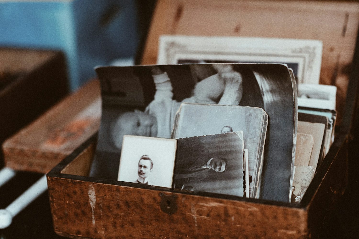 A wooden chest full of old family photographs